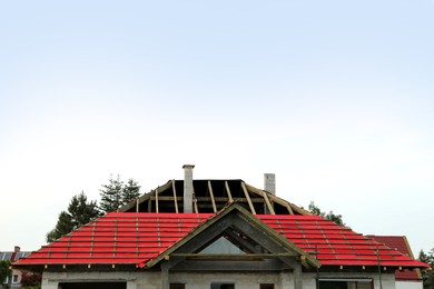 Roof of house under construction against sky
