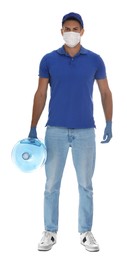 Courier in medical mask holding bottle for water cooler on white background. Delivery during coronavirus quarantine