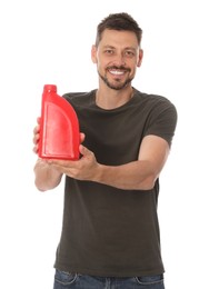 Man showing red container of motor oil on white background