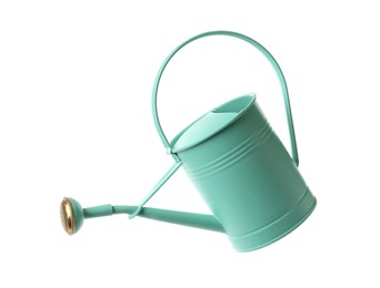 Photo of Turquoise metal watering can isolated on white