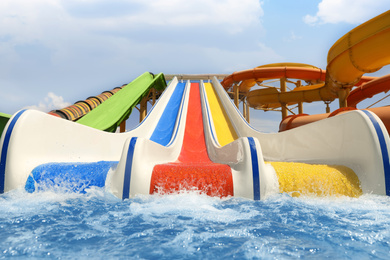 Colorful slides at water park. Summer vacation