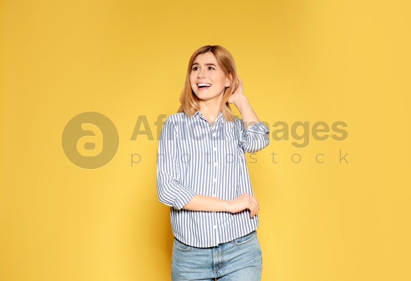 Portrait of emotional woman posing on color background