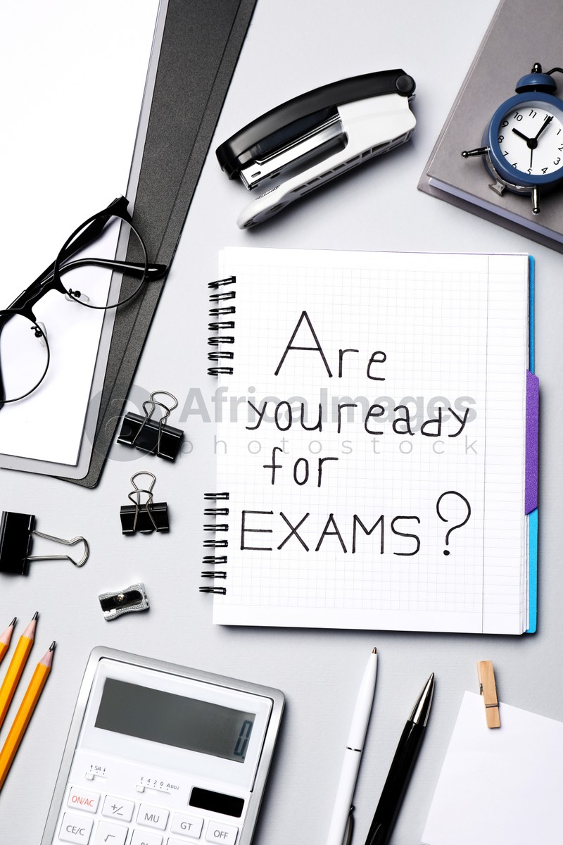 Notebook with question Are you ready for exams and stationery on grey table, flat lay