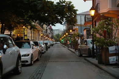 BATUMI, GEORGIA - MAY 31, 2022: Beautiful city street with buildings and parked cars in evening