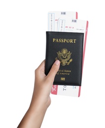 Woman holding passport with tickets on white background, closeup. Travel agency concept