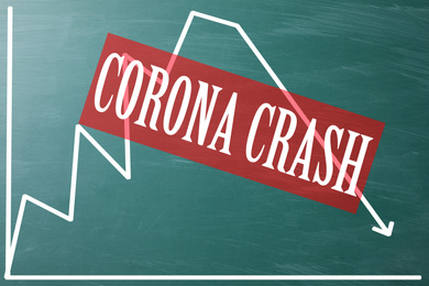 Text CORONA CRASH and chart on green chalkboard