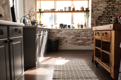 Stylish kitchen interior with modern furniture. Home design idea