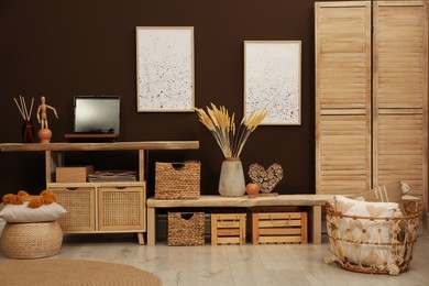 Trendy boho style furniture and decor in room. Interior design