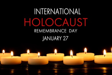 Image of International Holocaust Remembrance Day January 27. Burning candles on black background