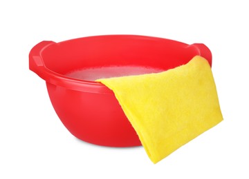 Red basin with detergent and rag on white background