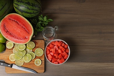 Fresh ingredients for making watermelon drink with lime on wooden table, above view. Space for text