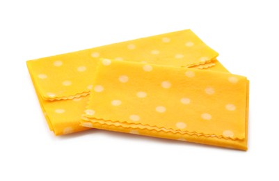 Reusable beeswax food wraps on white background