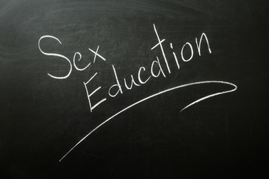 Phrase "SEX EDUCATION" written on black chalkboard