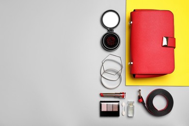 Flat lay composition with stylish woman's bag on color background. Space for text