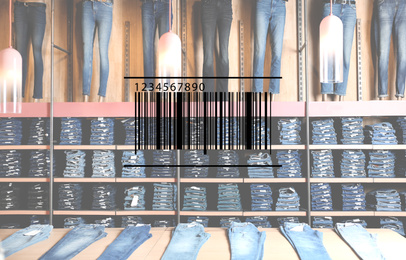 Barcode and collection of stylish jeans on display in wholesale shop