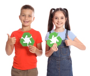Children with recycling symbols on white background