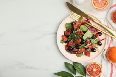 Photo of Delicious salad with sicilian orange served on white table, flat lay. Space for text