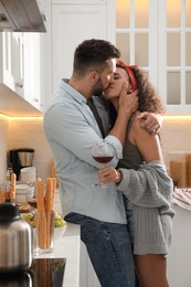 Lovely couple enjoying time together during romantic dinner in kitchen