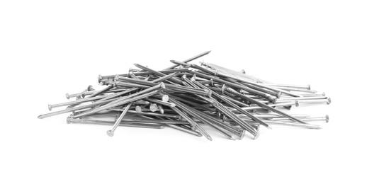 Photo of Pile of metal nails on white background