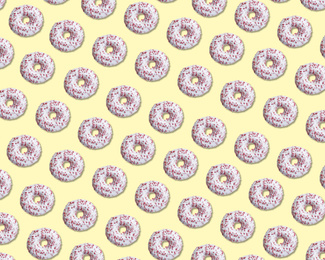Image of Creative pattern design of glazed donuts on pale yellow background