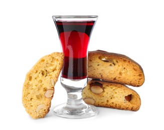 Photo of Tasty cantucci and glass of liqueur on white background. Traditional Italian almond biscuits