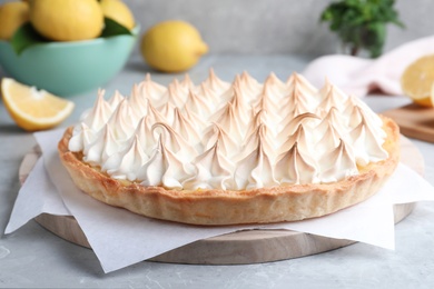 Delicious lemon meringue pie on grey table