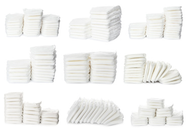 Set of baby diapers on white background