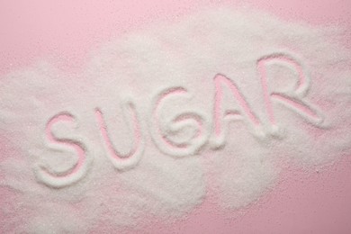 Photo of Composition with word SUGAR on pink background, top view