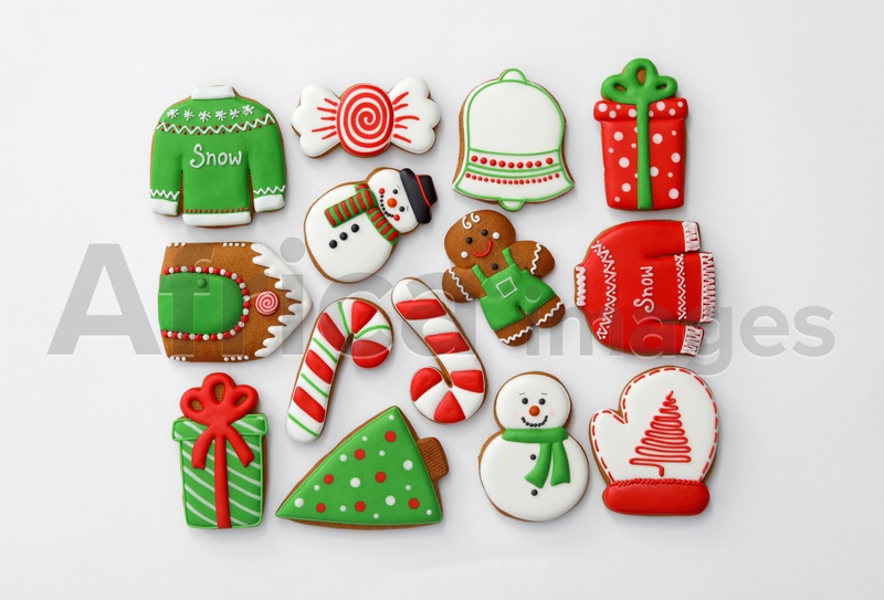 Different Christmas gingerbread cookies on white background, top view