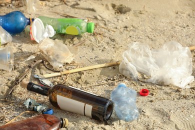 Garbage scattered on beach. Environment pollution problem