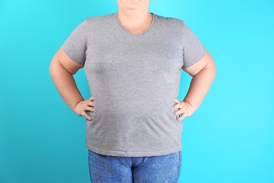 Photo of Overweight woman before weight loss on color background