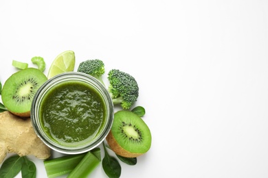 Delicious green juice and fresh ingredients on white background, top view