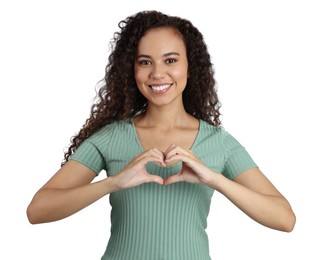 Happy young African-American woman making heart with hands on white background