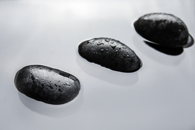 Spa stones in water, closeup. Zen lifestyle