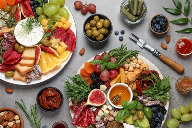 Set of different delicious appetizers served on light grey table, flat lay