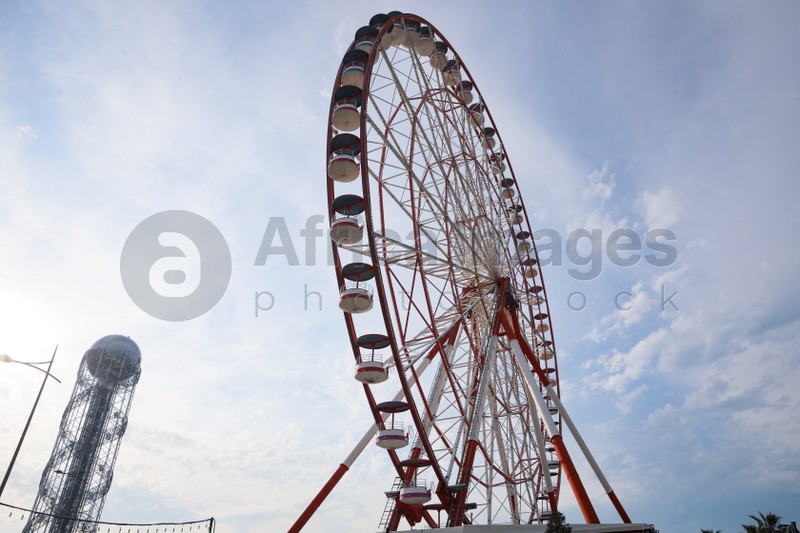 BATUMI, GEORGIA - MAY 31, 2022: Beautiful Ferris wheel outdoors, low angle view