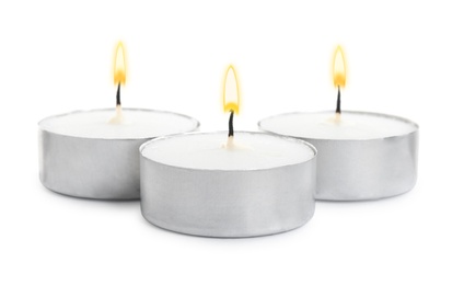 Photo of Wax candles on white background. Interior elements
