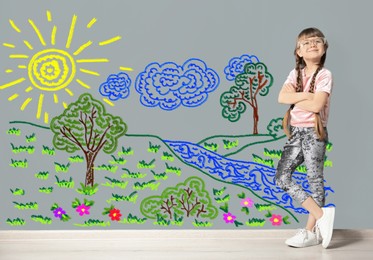 Portrait of cute child girl near colorful dyed gray wall