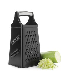 Stainless steel grater and fresh squash on white background