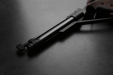 Sport pistol on black table. Professional gun