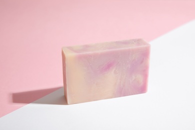 Hand made soap bar on color background