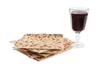 Traditional matzos and red wine on white background