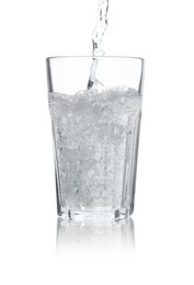 Photo of Pouring soda water into glass on white background