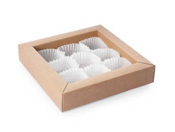 Photo of Empty box of chocolate sweets with candy paper cups isolated on white