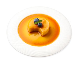 Photo of Delicious pudding with caramel on white background
