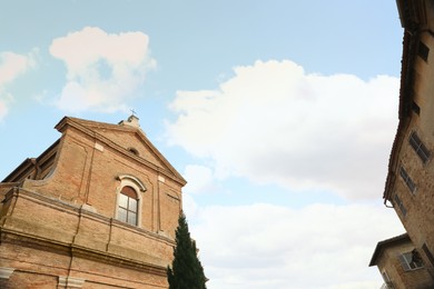 Exterior of beautiful church against blue sky, low angle view