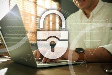 Cyber security concept. Illustration of lock and man working with laptop at wooden table, closeup