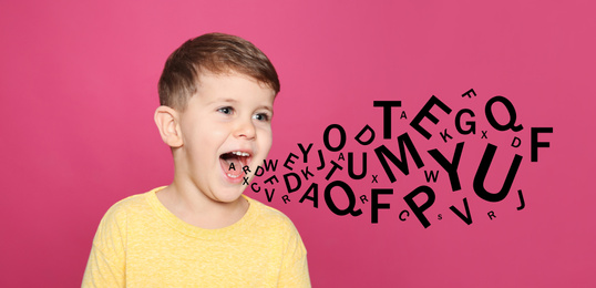 Portrait of little boy with letters on pink background. Speech therapy concept