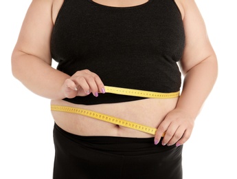 Overweight woman with measuring tape on white background, closeup