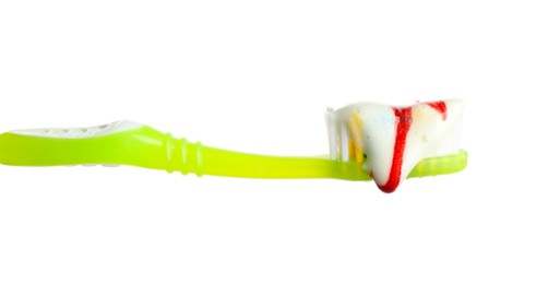 Brush and toothpaste foam with blood on white background. Gum problems